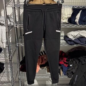 Sleek Black Joggers with Zipper Pockets